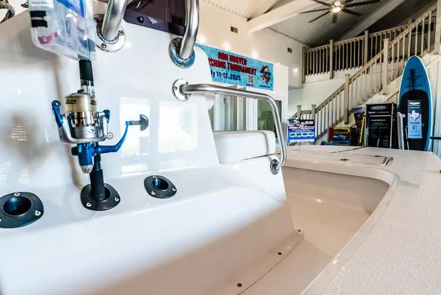 Slide: The Image of 2025 Majek 18 M2 boat interior with fishing rod holder, displayed indoors. - 6