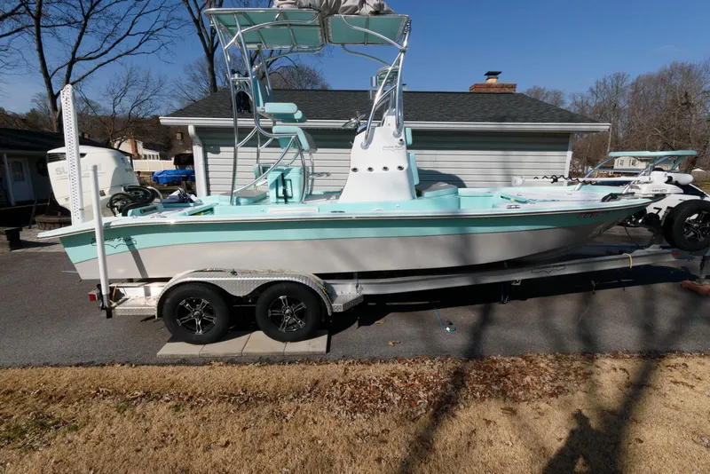 The Image of 2020 Shallow Sport 24 Modified V boat on trailer, parked in driveway. - 0