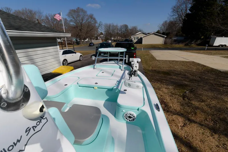 Slide: The Image of 2020 Shallow Sport 24 Modified V boat parked in residential driveway. - 7