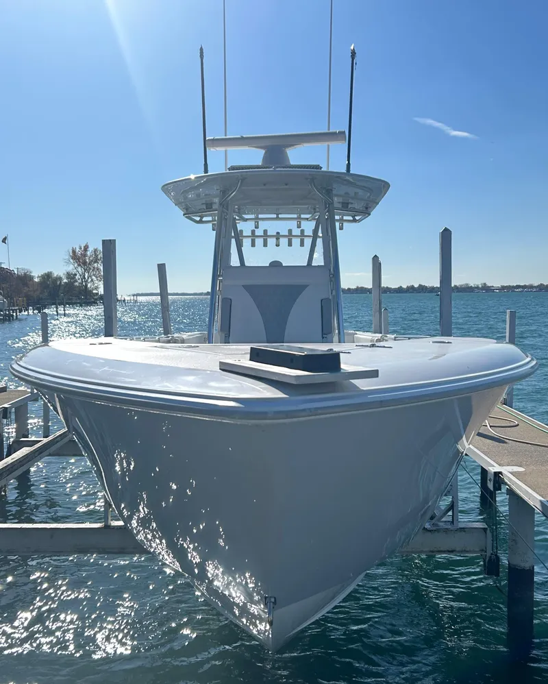 Slide: The Image of 2022 Contender 35 ST boat docked on a sunny day. - 10