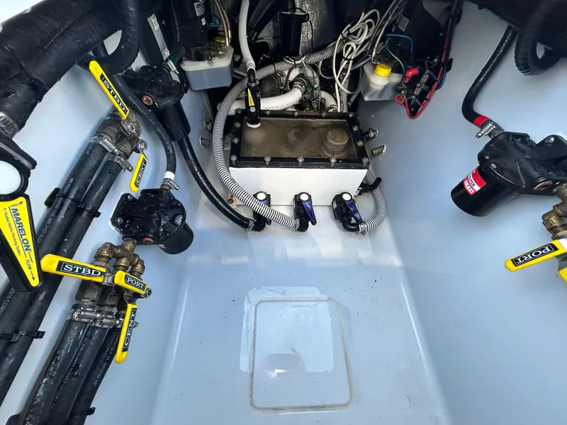 Slide: The Image of 2022 Contender 35 ST boat engine compartment with wiring and components. - 20