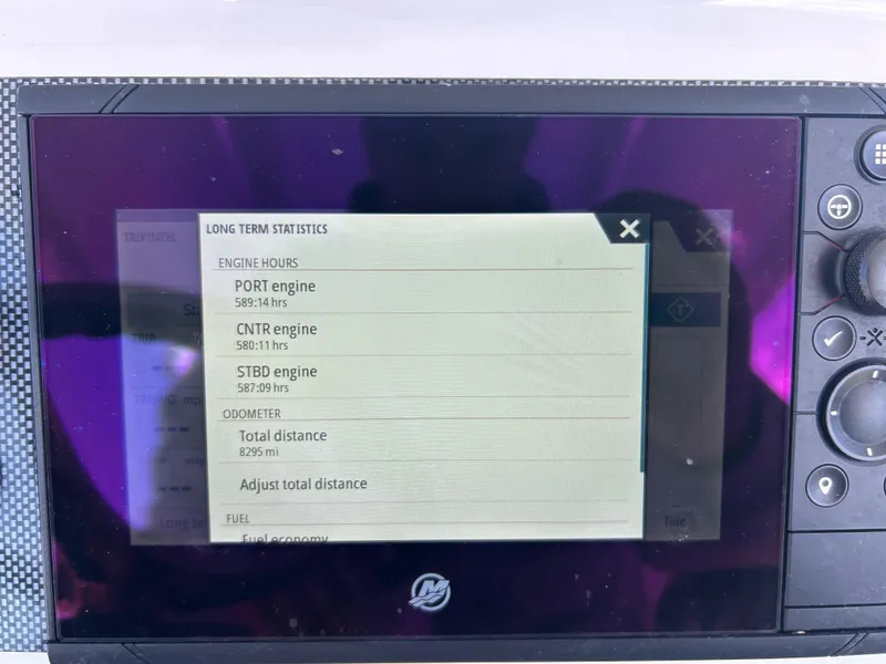 Slide: The Image of Display screen showing engine statistics for a 2022 Contender 35 ST boat. - 28