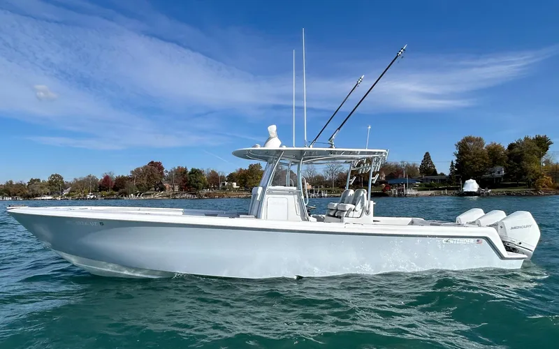 Slide: The Image of 2022 Contender 35 ST boat on clear water under blue sky. - 3