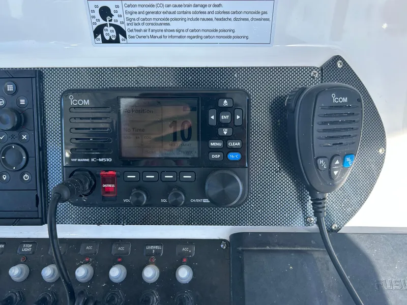 Slide: The Image of ICOM marine radio system on 2022 Contender 35 ST boat dashboard. - 30