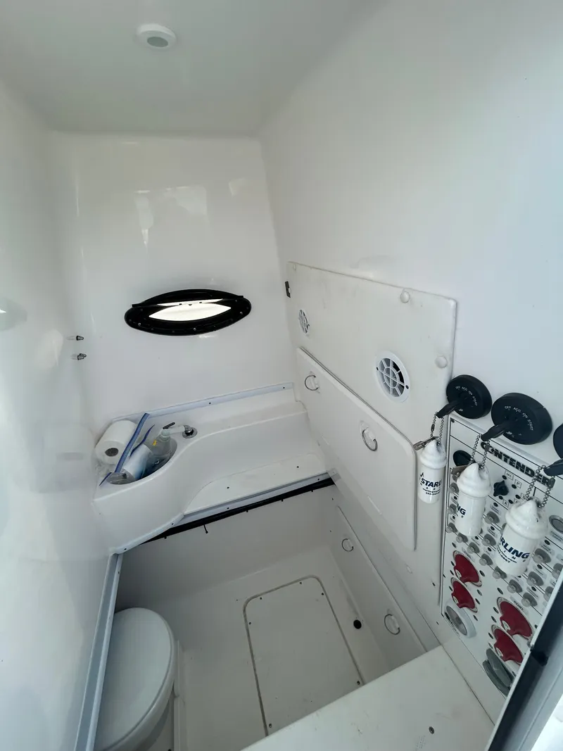 Slide: The Image of 2022 Contender 35 ST boat interior with storage and equipment. - 32