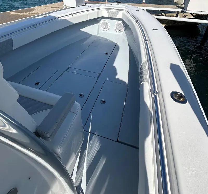 Slide: The Image of 2022 Contender 35 ST boat interior with seating and storage compartments. - 34