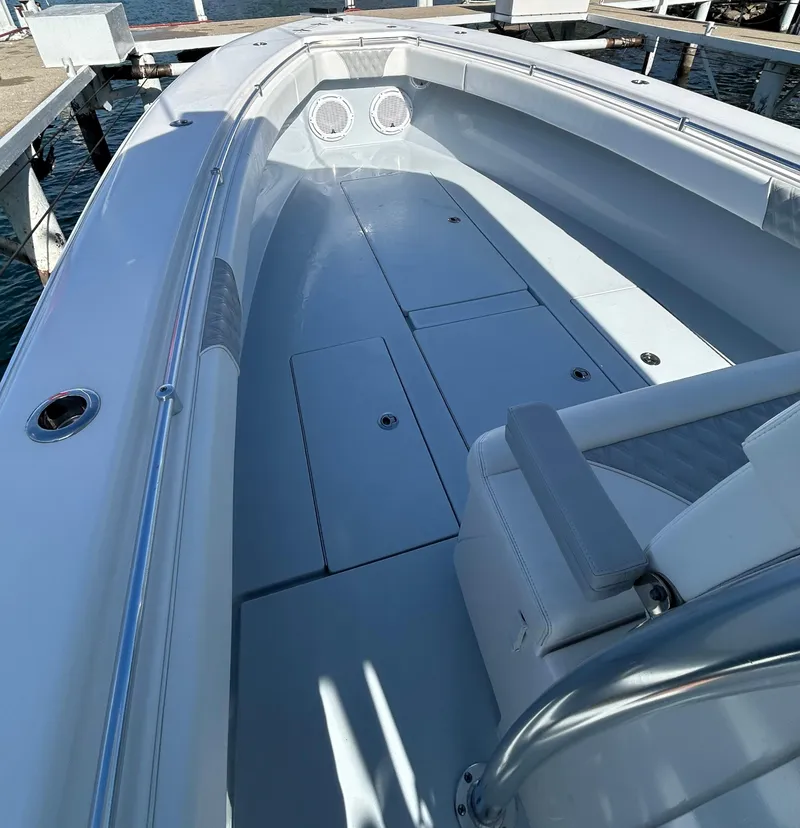 Slide: The Image of 2022 Contender 35 ST boat interior, featuring spacious deck and seating. - 35