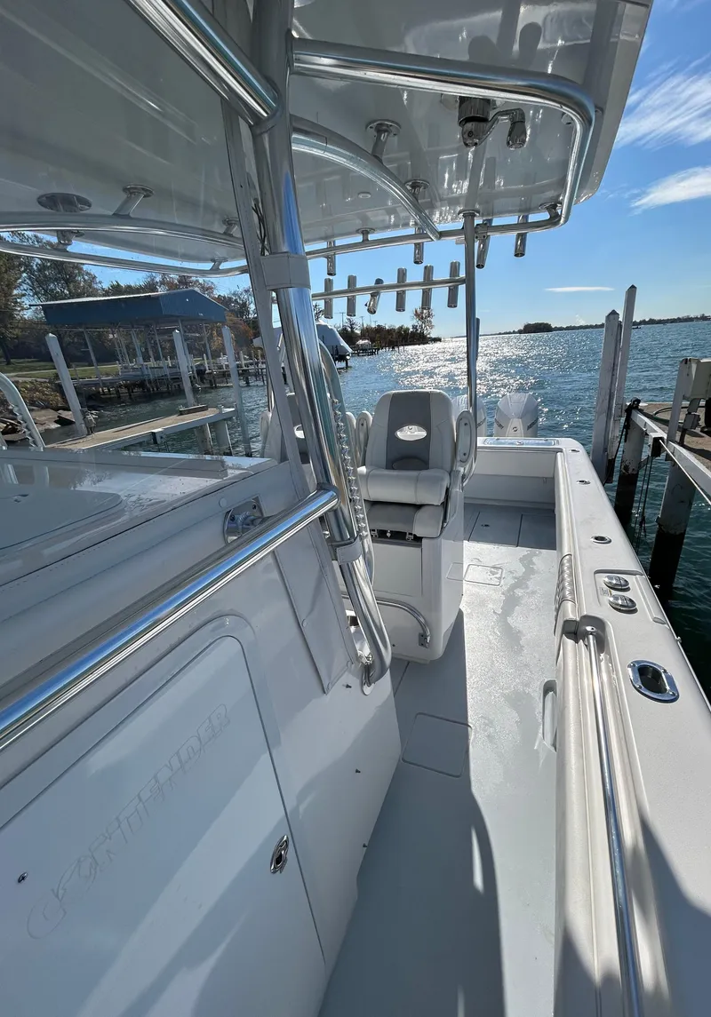 Slide: The Image of 2022 Contender 35 ST boat docked by the water on a sunny day. - 36