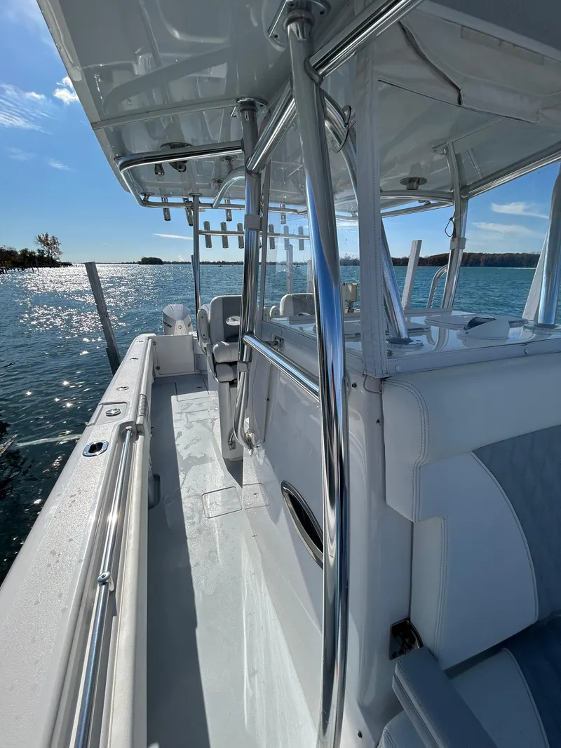 Slide: The Image of 2022 Contender 35 ST boat on water, showcasing sleek design and spacious deck. - 37