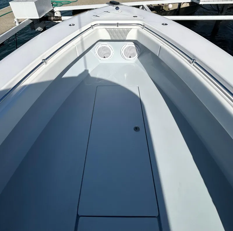 Slide: The Image of 2022 Contender 35 ST boat deck with storage compartment and speakers. - 43