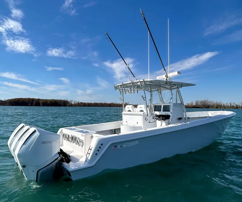 Slide: The Image of 2022 Contender 35 ST boat on clear blue water under a sunny sky. - 5
