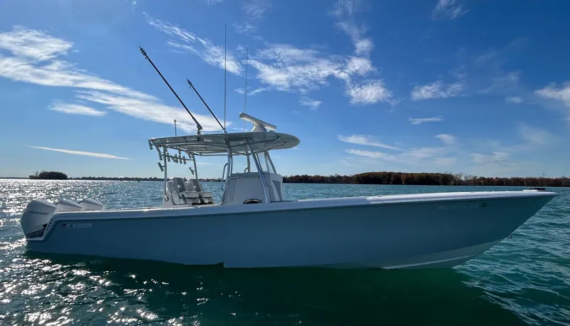 Slide: The Image of 2022 Contender 35 ST boat on calm water under a clear blue sky. - 7