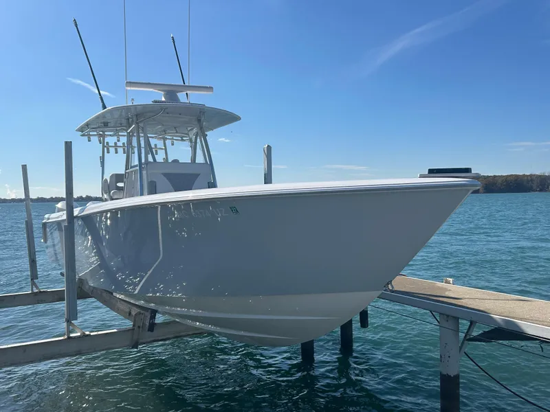 Slide: The Image of 2022 Contender 35 ST boat docked on a sunny day. - 9