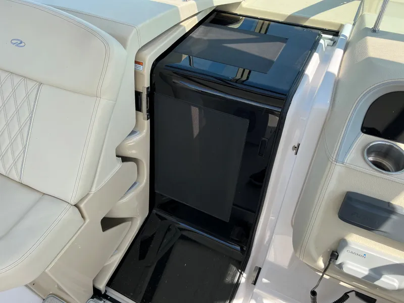 Slide: The Image of Luxurious interior of 2021 Regal 33 Express boat with sleek seating and modern amenities. - 14