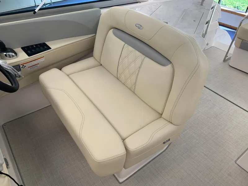 Slide: The Image of 2021 Regal 33 Express boat interior with beige leather seating and modern design. - 32