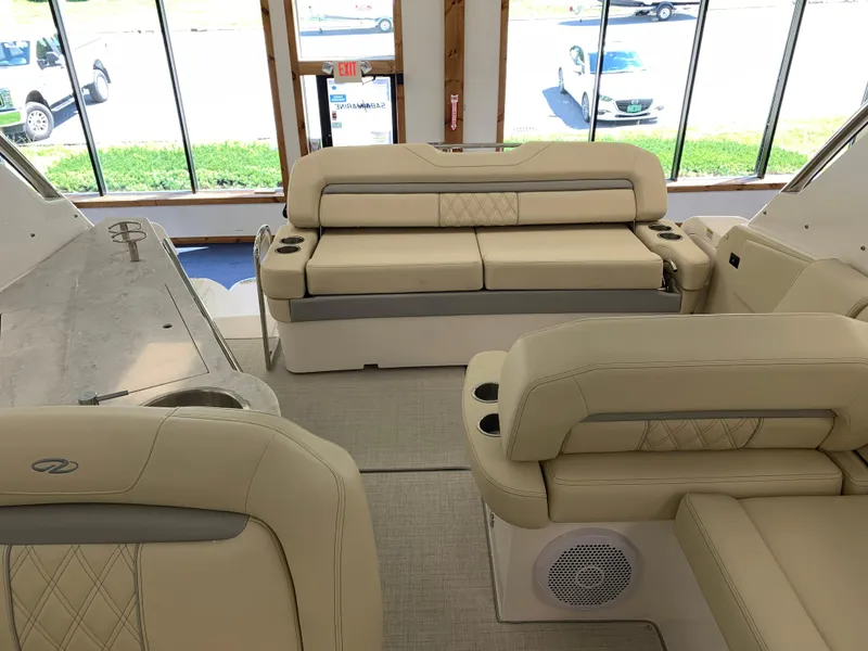 Slide: The Image of Interior of 2021 Regal 33 Express boat with beige seating and modern design. - 33