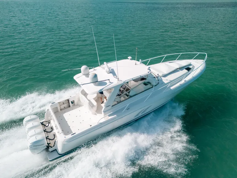 Slide: The Image of 2009 Intrepid 475 Sport Yacht cruising on clear blue water. - 11