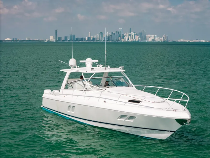Slide: The Image of 2009 Intrepid 475 Sport Yacht on ocean with city skyline in background. - 20