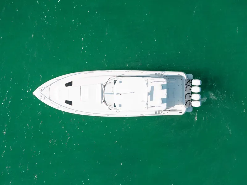 Slide: The Image of Aerial view of 2009 Intrepid 475 Sport Yacht on turquoise water. - 23
