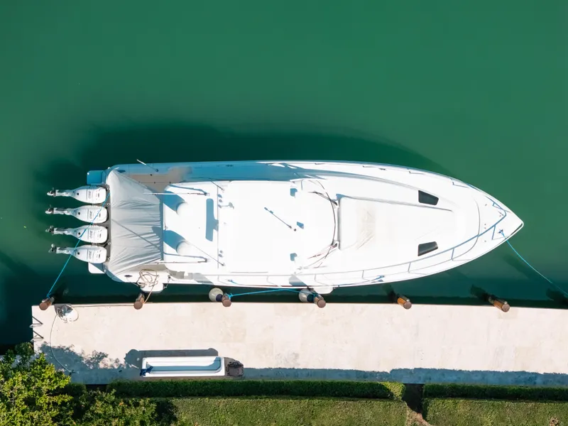 Slide: The Image of Aerial view of 2009 Intrepid 475 Sport Yacht docked on calm water. - 26