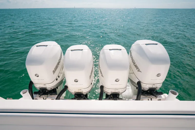 Slide: The Image of Four powerful outboard engines on a 2009 Intrepid 475 Sport Yacht, cruising on open water. - 27