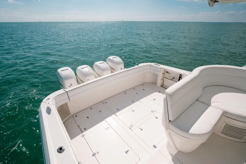 Slide: The Image of 2009 Intrepid 475 Sport Yacht deck with ocean view and seating area. - 40