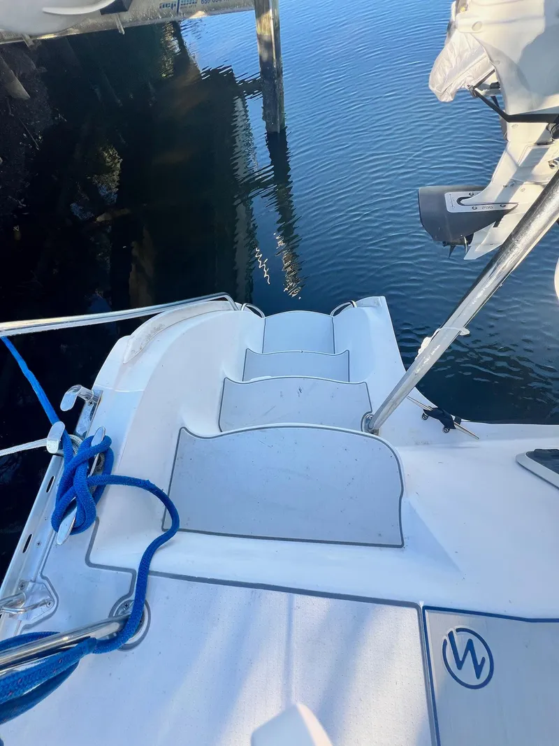 Slide: The Image of 2006 PDQ MV34 boat stern with steps leading to water. - 19