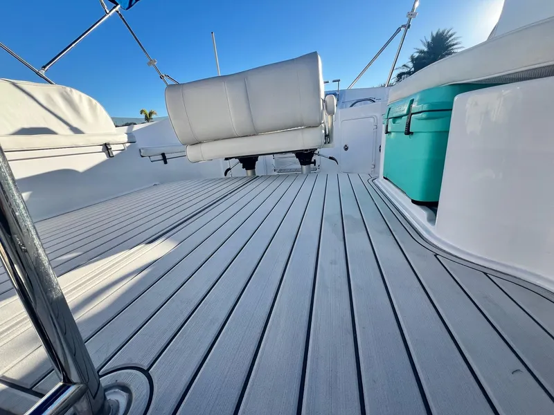 Slide: The Image of Spacious deck of 2006 PDQ MV34 boat with seating and storage. - 22