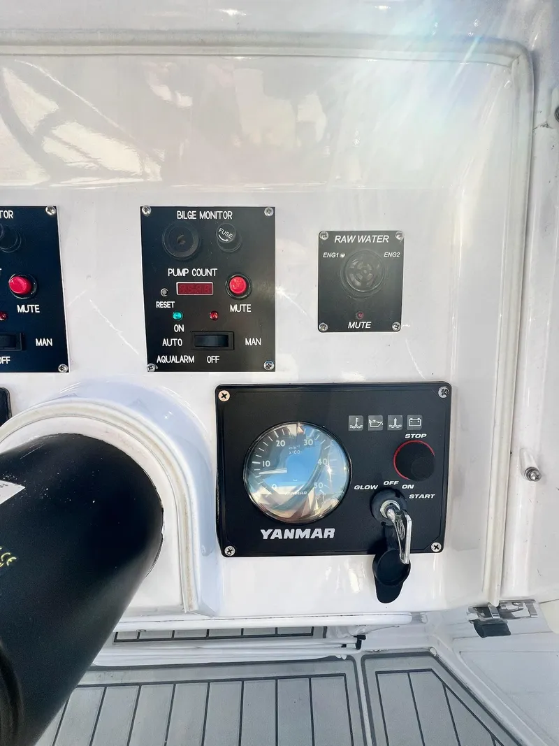 Slide: The Image of Control panel of a 2006 PDQ MV34 boat with Yanmar engine display. - 32
