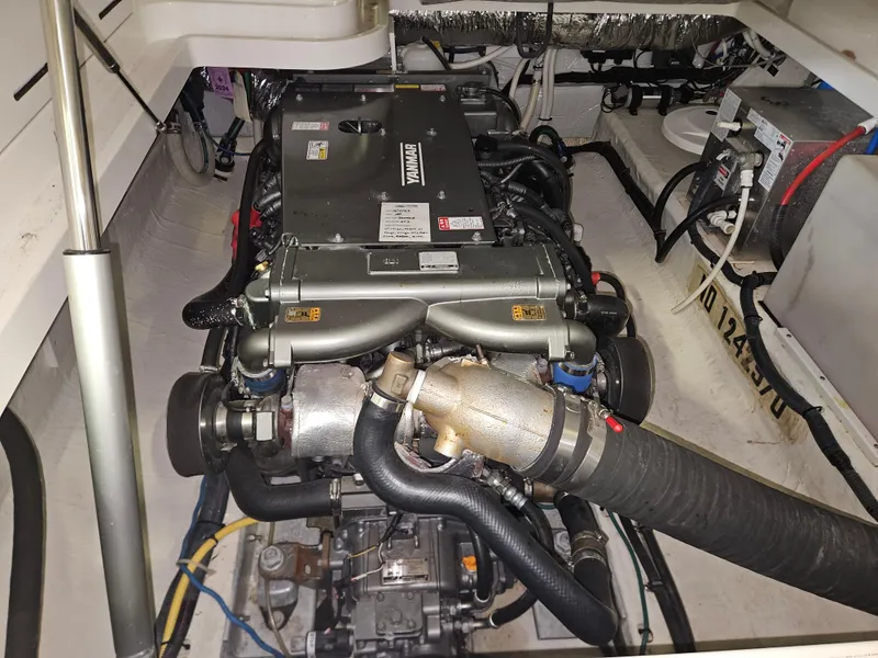 Slide: The Image of Engine compartment of a 2012 Back Cove 30 boat, featuring a Yanmar engine. - 14