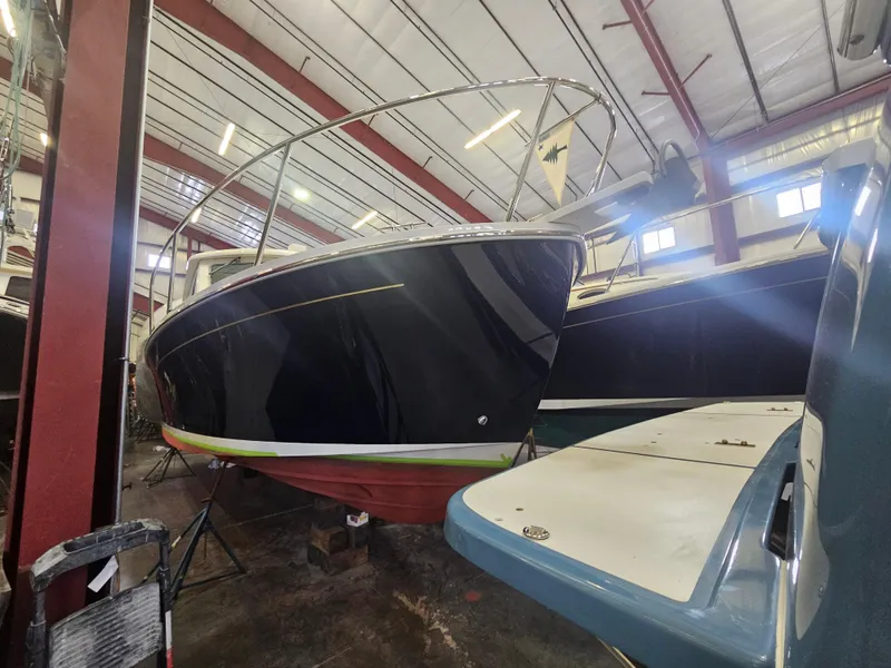 Slide: The Image of 2012 Back Cove 30 boat in indoor storage facility. - 2