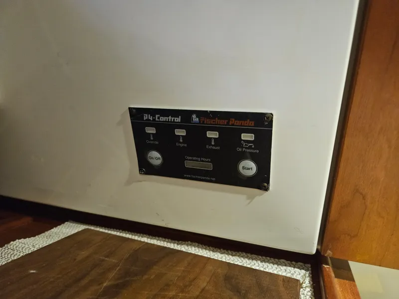 Slide: The Image of Control panel on a 2012 Back Cove 30 boat, featuring Fischer Panda system. - 20
