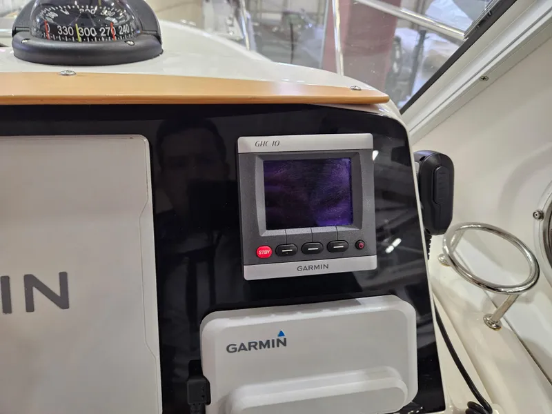 Slide: The Image of Garmin navigation equipment on 2012 Back Cove 30 boat dashboard. - 22