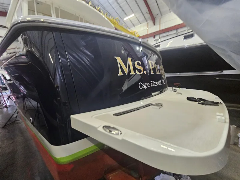 Slide: The Image of 2012 Back Cove 30 boat in storage, featuring "Ms. P" and Cape Elizabeth, ME. - 5