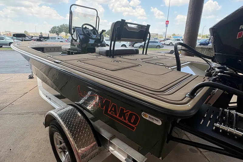 Slide: The Image of The image shows a 2025 Mako 18 Pro Skiff Backwater Edition boat on a trailer. - 6