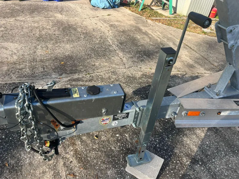 Slide: The Image of Trailer hitch and jack for 2023 Sea Fox 268 Commander boat on concrete surface. - 14