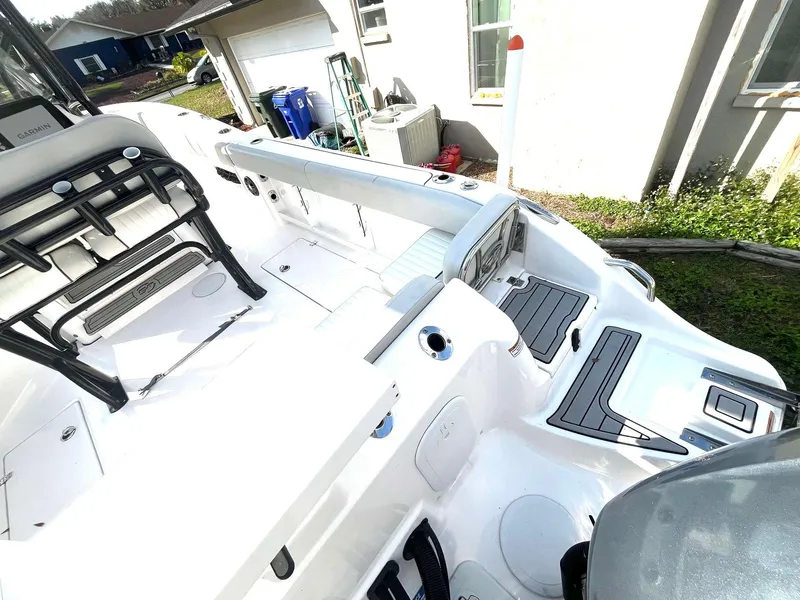 Slide: The Image of 2023 Sea Fox 268 Commander boat interior, featuring seating and storage areas. - 17