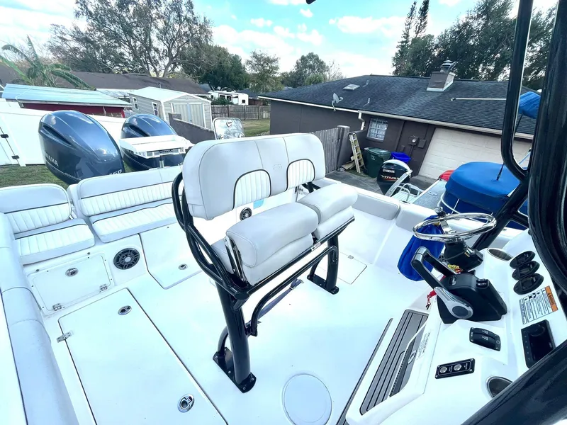 Slide: The Image of 2023 Sea Fox 268 Commander boat interior with dual seating and control panel. - 26