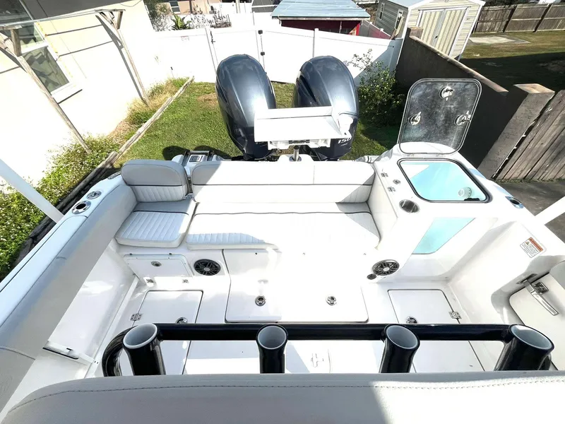 Slide: The Image of 2023 Sea Fox 268 Commander boat interior with dual engines and seating area. - 35