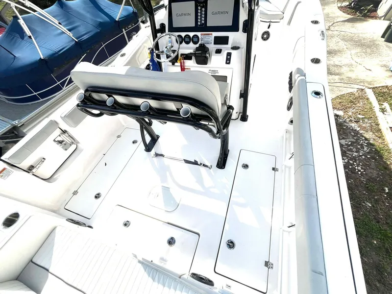 Slide: The Image of 2023 Sea Fox 268 Commander boat interior with helm, seating, and storage compartments. - 36