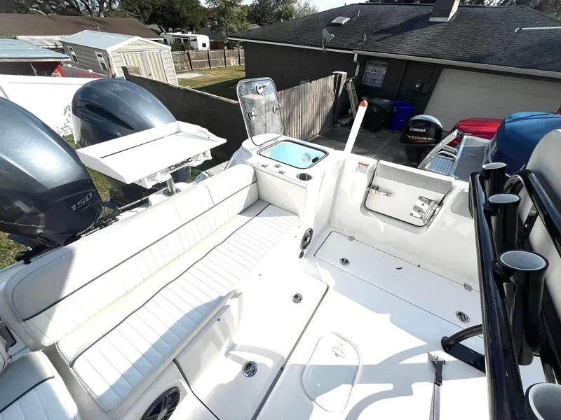 Slide: The Image of 2023 Sea Fox 268 Commander boat interior with seating and dual outboard engines. - 37
