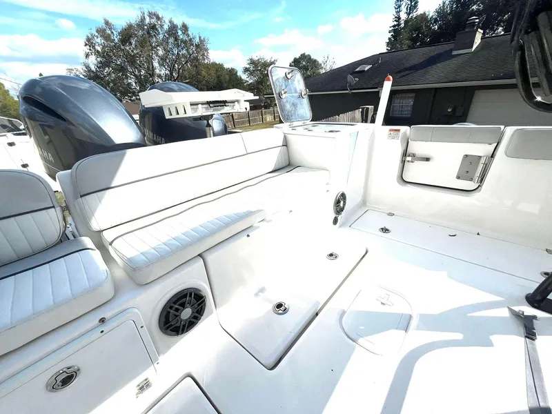 Slide: The Image of 2023 Sea Fox 268 Commander boat interior with white seating and storage compartments. - 39