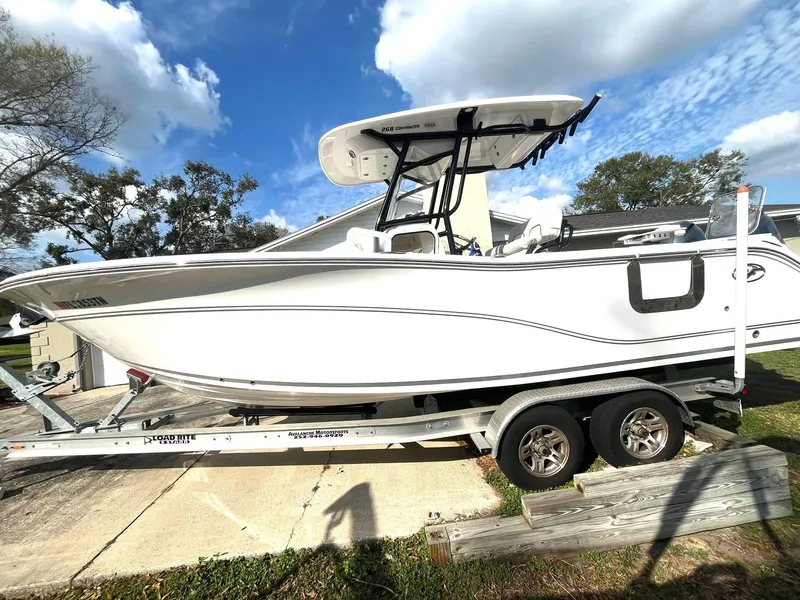 Slide: The Image of 2023 Sea Fox 268 Commander boat on trailer under blue sky. - 4