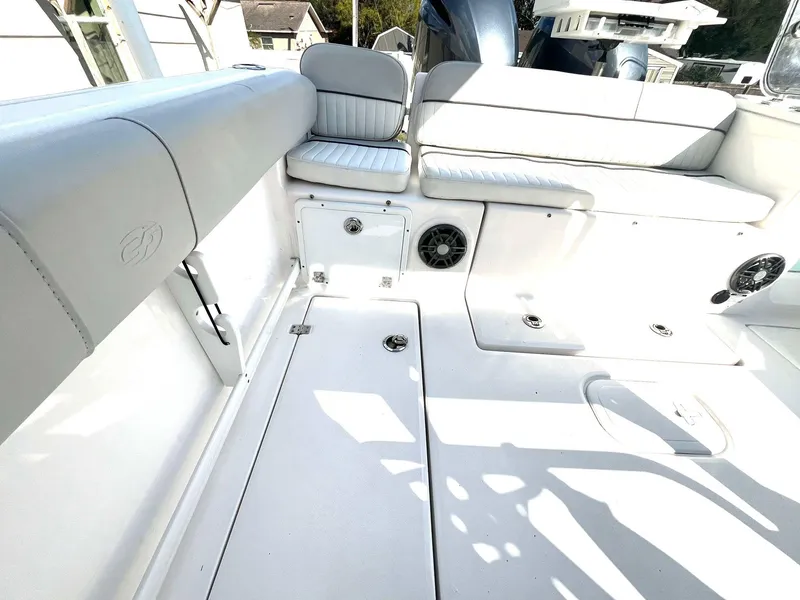 Slide: The Image of 2023 Sea Fox 268 Commander boat interior with white seating and storage compartments. - 40