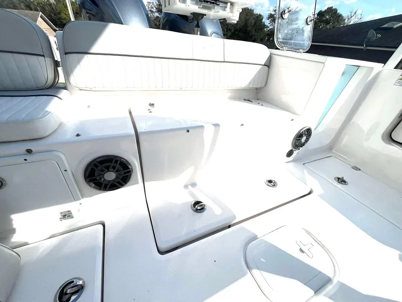 Slide: The Image of 2023 Sea Fox 268 Commander boat interior with white seating and storage compartments. - 44