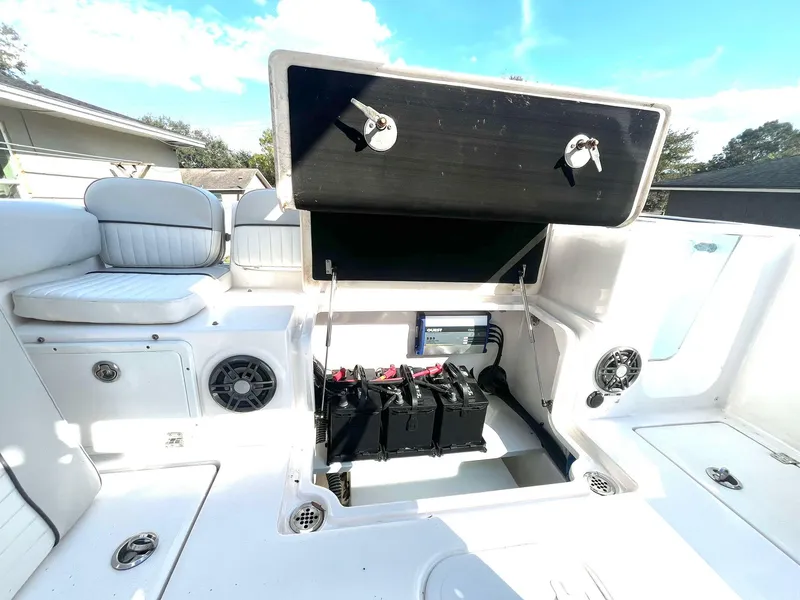 Slide: The Image of 2023 Sea Fox 268 Commander boat interior with open storage compartment and seating. - 45