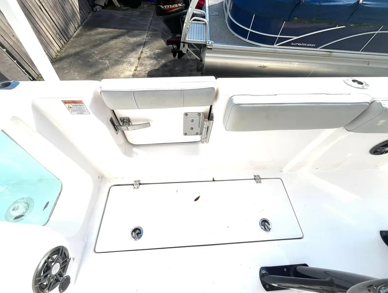 Slide: The Image of 2023 Sea Fox 268 Commander boat interior with seating and storage compartments. - 46