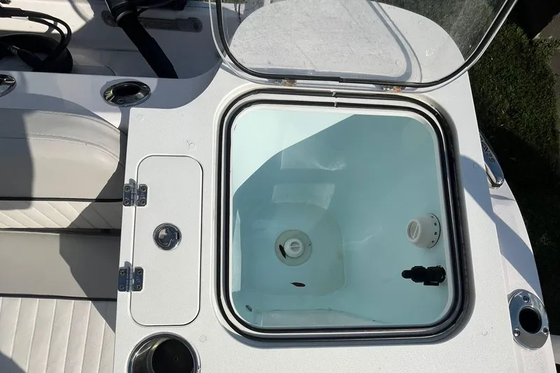 Slide: The Image of Livewell on 2023 Sea Fox 268 Commander boat, open lid, white interior. - 48