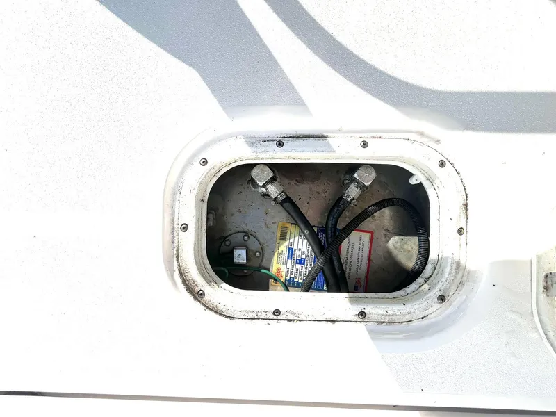 Slide: The Image of Battery compartment of 2023 Sea Fox 268 Commander boat, showing cables and connections. - 49