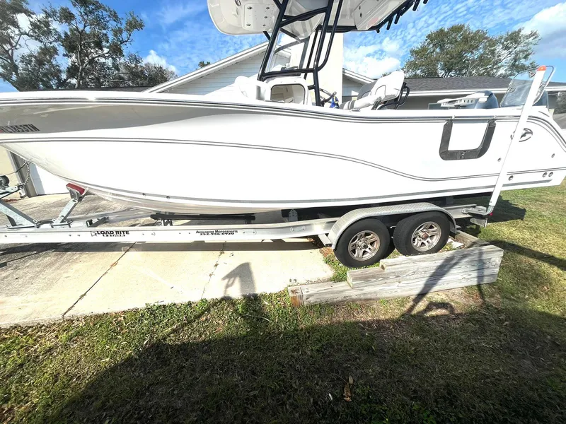 Slide: The Image of 2023 Sea Fox 268 Commander boat on trailer, parked outdoors. - 5